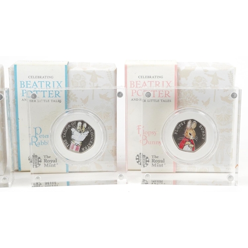 1656 - Four Beatrix Potter silver proof fifty pence pieces by The Royal Mint with display blocks and boxes,... 