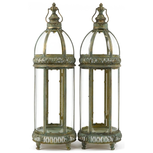 1396 - Pair of bronzed hanging lanterns with glass panels, each 79cm high