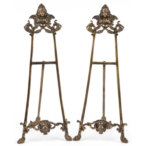 1470 - Pair of Rococo style brass easel stands, each 56cm high