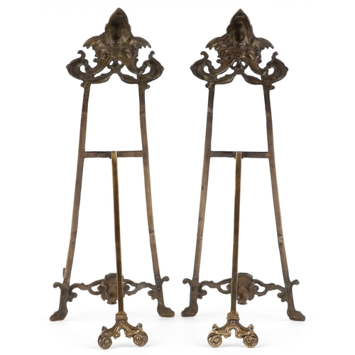 1470 - Pair of Rococo style brass easel stands, each 56cm high