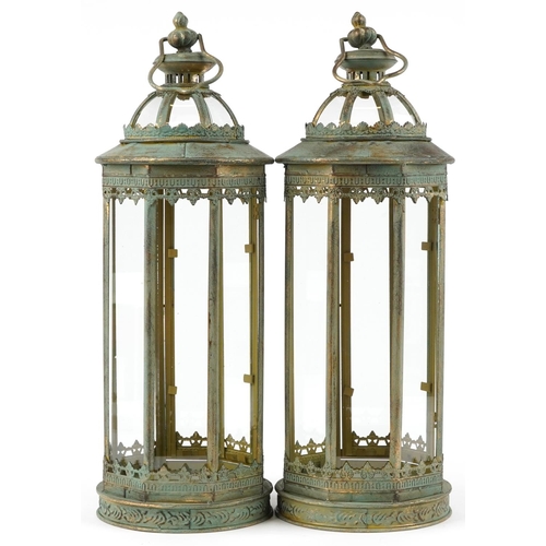 1406 - Pair of bronzed hanging lanterns with glass panels, 59cm high