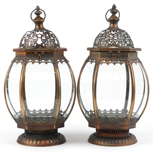 1409 - Pair of bronzed hanging lanterns with glass panels, 50cm high