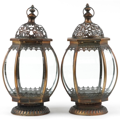 1409 - Pair of bronzed hanging lanterns with glass panels, 50cm high