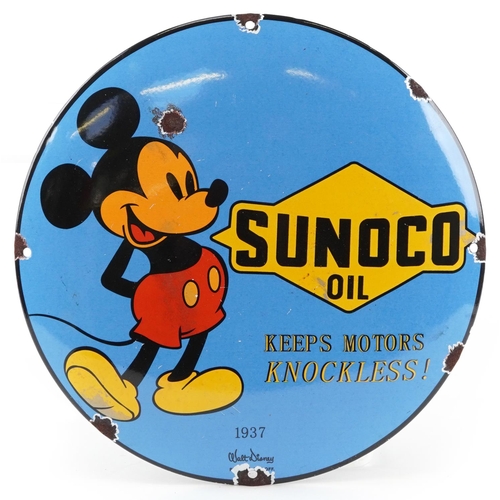 1418 - Automobilia interest Sunoco Oil convex enamel advertising sign with Mickey Mouse, 30cm in diameter