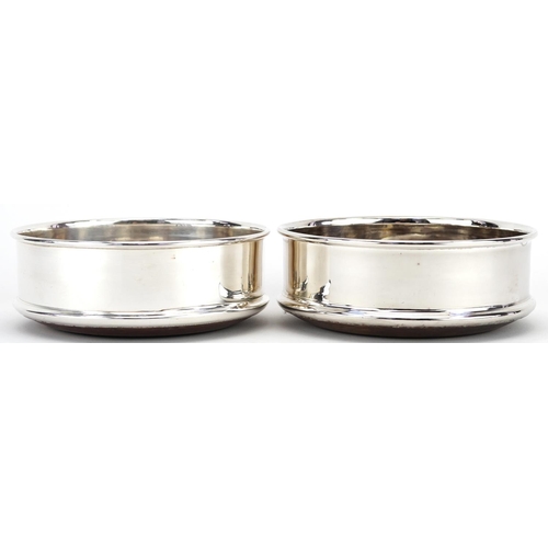 1320 - Pair of silver plated and oak circular wine coasters, 12.5cm in diameter