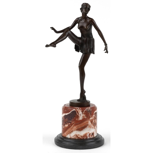 491 - Patinated bronze statuette of a semi nude Art Deco female dancer raised on a circular marble and bla... 