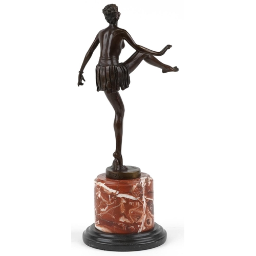 491 - Patinated bronze statuette of a semi nude Art Deco female dancer raised on a circular marble and bla... 