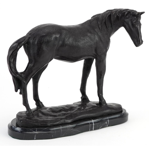 493 - Patinated bronze study of a horse raised on a black marble base, 25cm in length