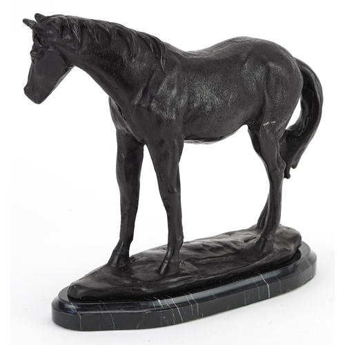 493 - Patinated bronze study of a horse raised on a black marble base, 25cm in length