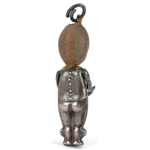 627 - British military white metal Fumsup lucky charm, registered design number 636812, 3cm high