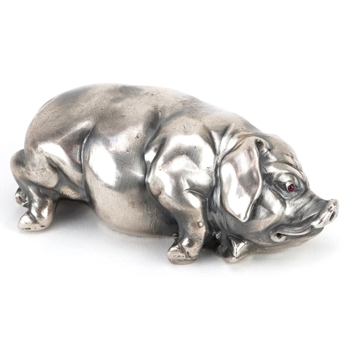 261 - Silver recumbent pig with cabochon ruby eyes, impressed Russian marks to the base, 7cm in length, 42... 