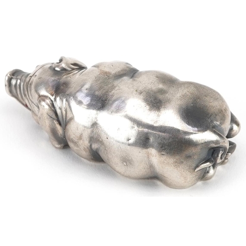 261 - Silver recumbent pig with cabochon ruby eyes, impressed Russian marks to the base, 7cm in length, 42... 