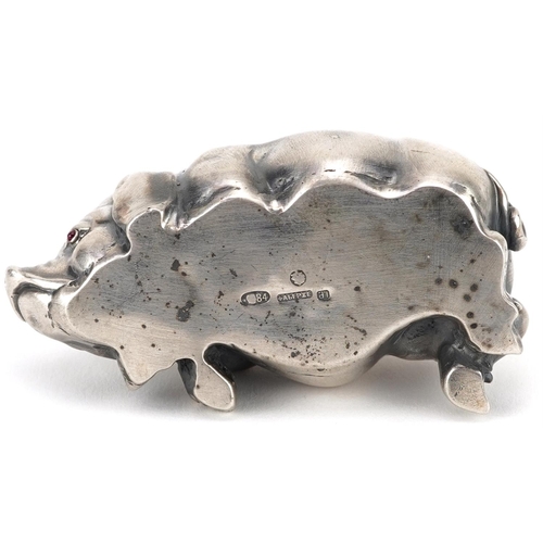 261 - Silver recumbent pig with cabochon ruby eyes, impressed Russian marks to the base, 7cm in length, 42... 