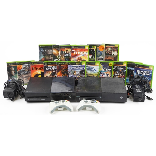 1625 - Two Microsoft Xbox One games consoles with controllers and a collection of games