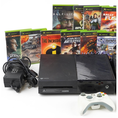 1625 - Two Microsoft Xbox One games consoles with controllers and a collection of games