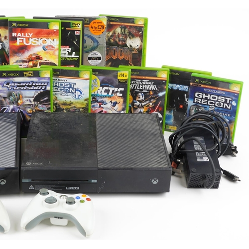 1625 - Two Microsoft Xbox One games consoles with controllers and a collection of games