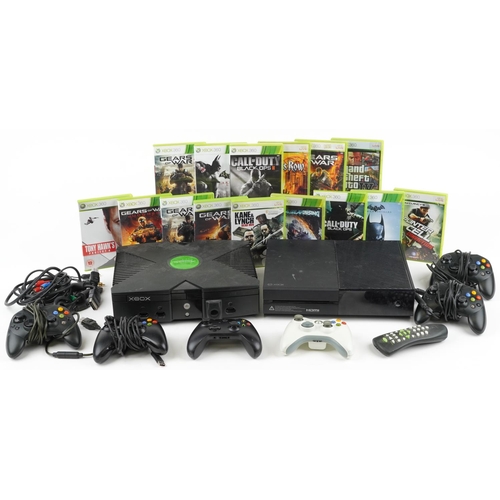 1619 - Two Microsoft Xbox games consoles with controllers and a collection of games