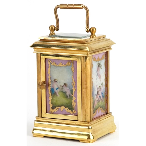 1504 - Miniature brass cased carriage clock with swing handle and Sevres style panels hand painted with Put... 