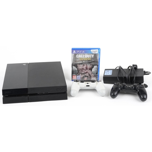 1623 - Sony PlayStation 4 games console with two controllers and Call of Duty World War II