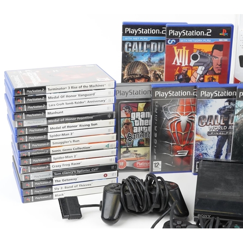 1621 - Sony PlayStation 3 games console with a collection of PlayStation 2 games and four PlayStation 1 con... 