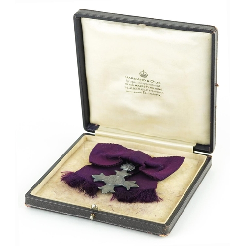 621 - Military interest George V silver MBE awarded to Mrs E V Holford housed in a tooled leather silk and... 