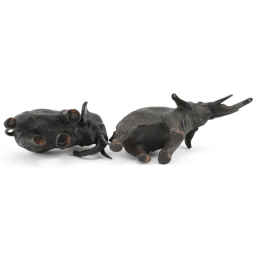 24 - Two Japanese patinated bronze elephants, Meiji period, each with character marks to the feet, the la... 