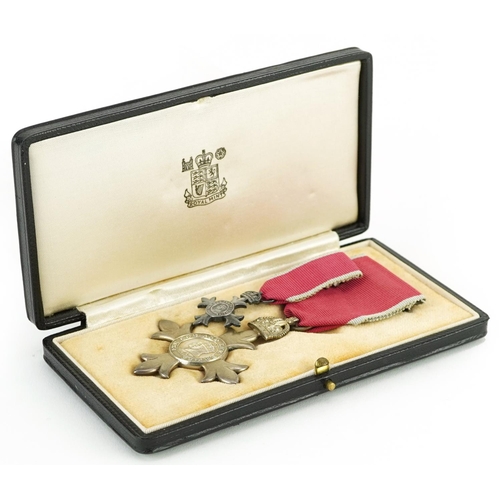 622 - Military interest George V MBE with dress medal housed in a tooled leather Royal Mint case