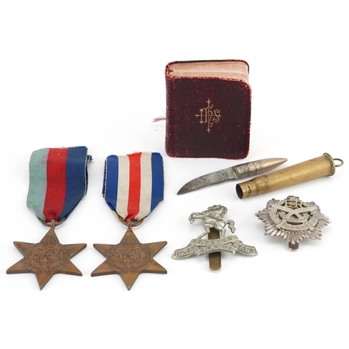 617 - British militaria comprising two World War II medals, trench art bullet knife, Gurkha Transport Regi... 