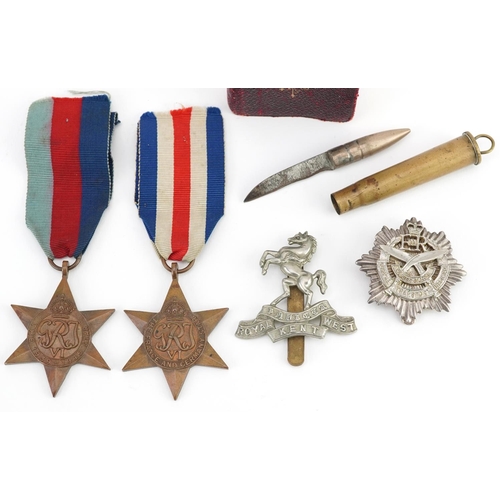 617 - British militaria comprising two World War II medals, trench art bullet knife, Gurkha Transport Regi... 