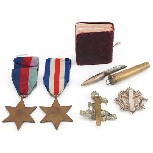 617 - British militaria comprising two World War II medals, trench art bullet knife, Gurkha Transport Regi... 