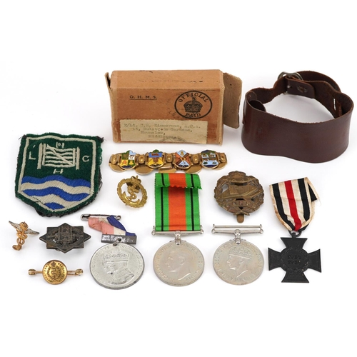 618 - British and German militaria including cross medal, Tank Corps cap badge, two World War II medals wi... 