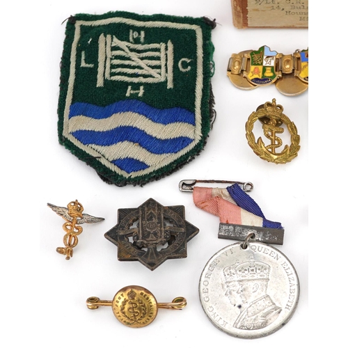 618 - British and German militaria including cross medal, Tank Corps cap badge, two World War II medals wi... 