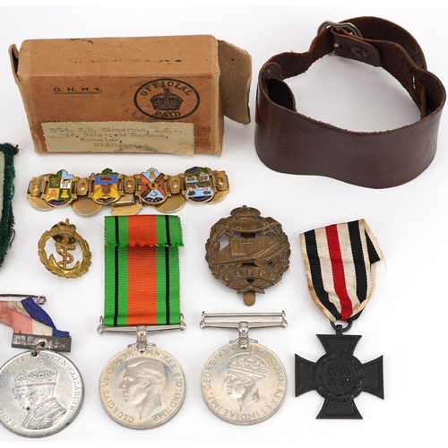 618 - British and German militaria including cross medal, Tank Corps cap badge, two World War II medals wi... 