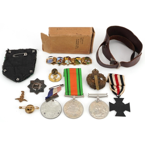 618 - British and German militaria including cross medal, Tank Corps cap badge, two World War II medals wi... 