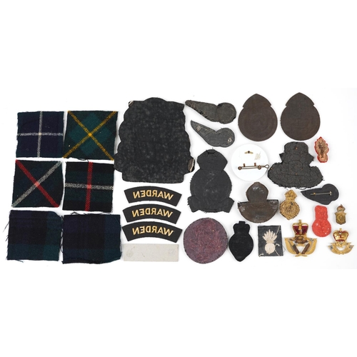 634 - Military interest cloth badges and shoulder titles including Air Gunner and Warden