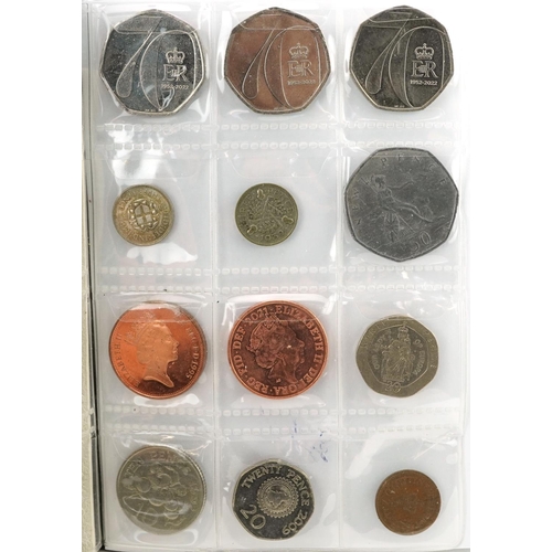 1654 - Collection of British coinage arranged in two coin stock books including two pounds, one pounds and ... 