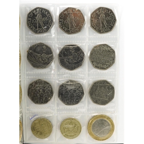 1654 - Collection of British coinage arranged in two coin stock books including two pounds, one pounds and ... 