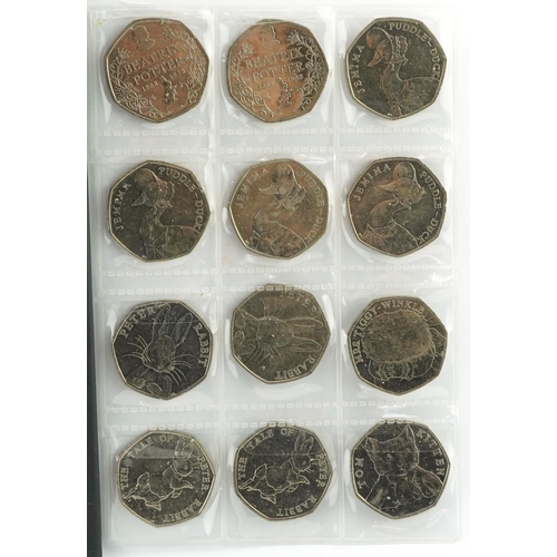 1654 - Collection of British coinage arranged in two coin stock books including two pounds, one pounds and ... 