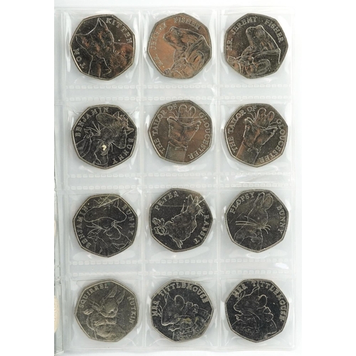 1654 - Collection of British coinage arranged in two coin stock books including two pounds, one pounds and ... 