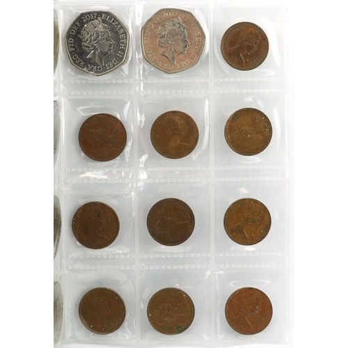 1654 - Collection of British coinage arranged in two coin stock books including two pounds, one pounds and ... 