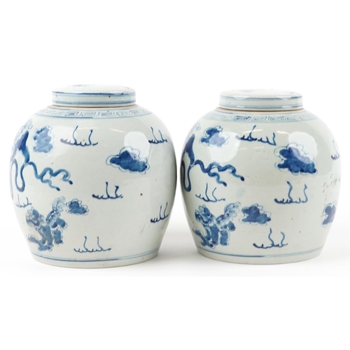 78 - Pair of Chinese blue and white porcelain ginger jars with covers hand painted with qilins amongst cl... 