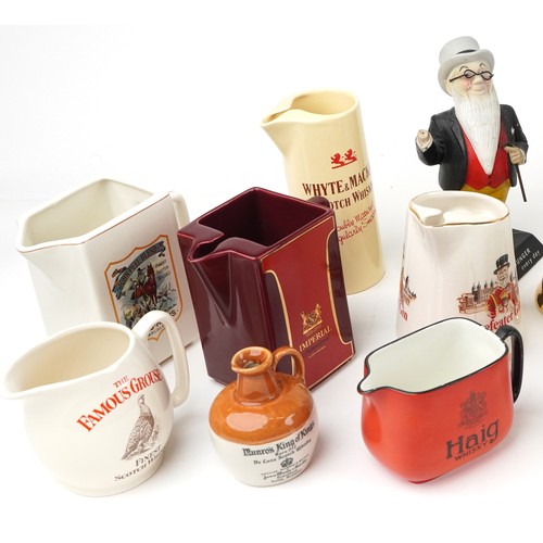 1123 - Collection of breweriana interest advertising pub jugs and flagons and an advertising figure includi... 