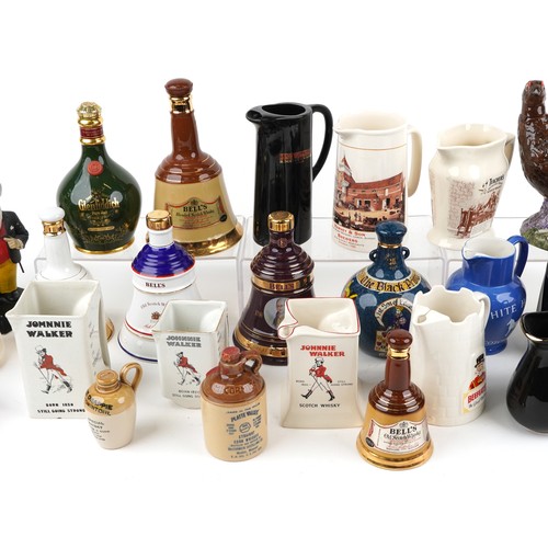 1123 - Collection of breweriana interest advertising pub jugs and flagons and an advertising figure includi... 