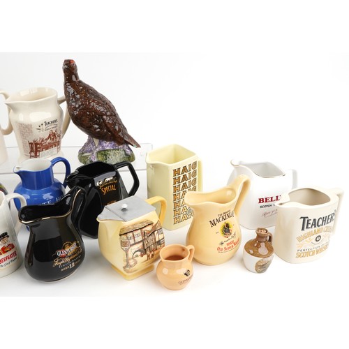 1123 - Collection of breweriana interest advertising pub jugs and flagons and an advertising figure includi... 