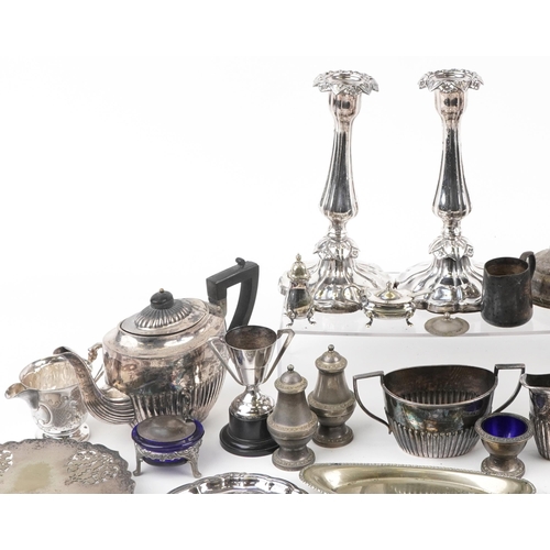 1391 - Silver plate and metalware including pair of candlesticks, teapots and flatware