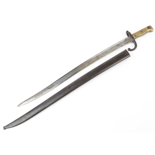 664 - French military interest St Etienne pattern bayonet with scabbard, 71.5cm in length