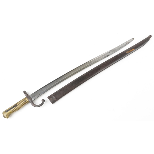 664 - French military interest St Etienne pattern bayonet with scabbard, 71.5cm in length