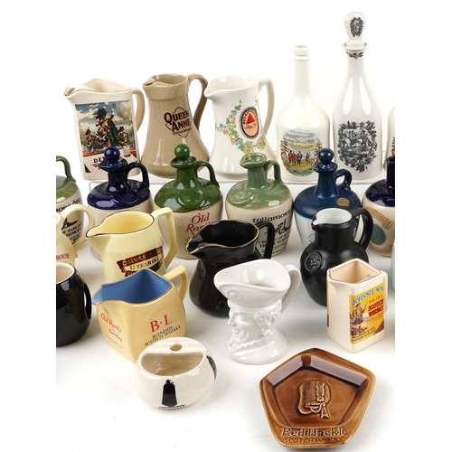 1124 - Extensive collection of breweriana interest advertising jugs and flagons including Jamieson, Glenfid... 