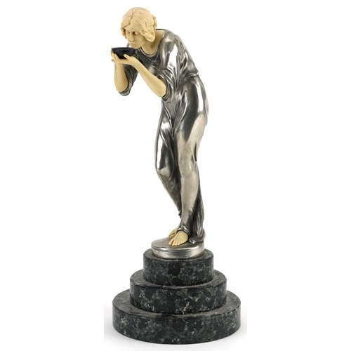 351 - After Victor Seifert, Art Deco style silvered and ivorine statuette of a thirsty young female raised... 