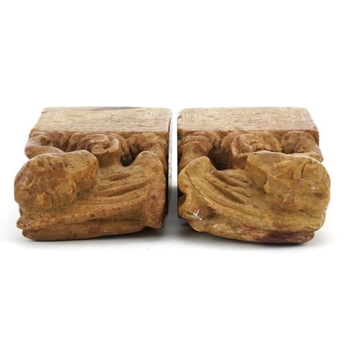 1322 - Pair of Chinese soapstone seals, each carved with a mythical animal, each 12.5cm high